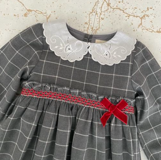 Grey gingham dress with smocked details and bow on chest, lace collar